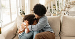 Mother, child and sad on sofa with comfort for mental health support, depression and parenting in living room of home. Family, mom and girl kid or hug with regret for conflict, argument or punishment