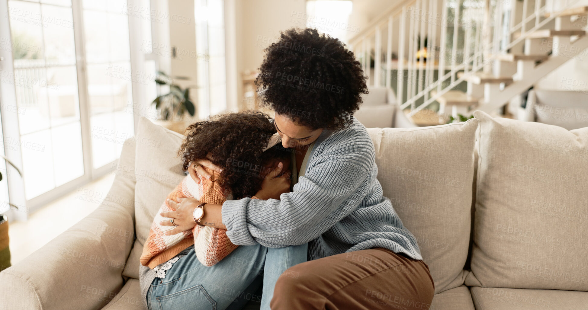 Buy stock photo Mother, child and sad on sofa with comfort for mental health support, depression and parenting in living room of home. Family, mom and girl kid or hug with regret for conflict, argument or punishment