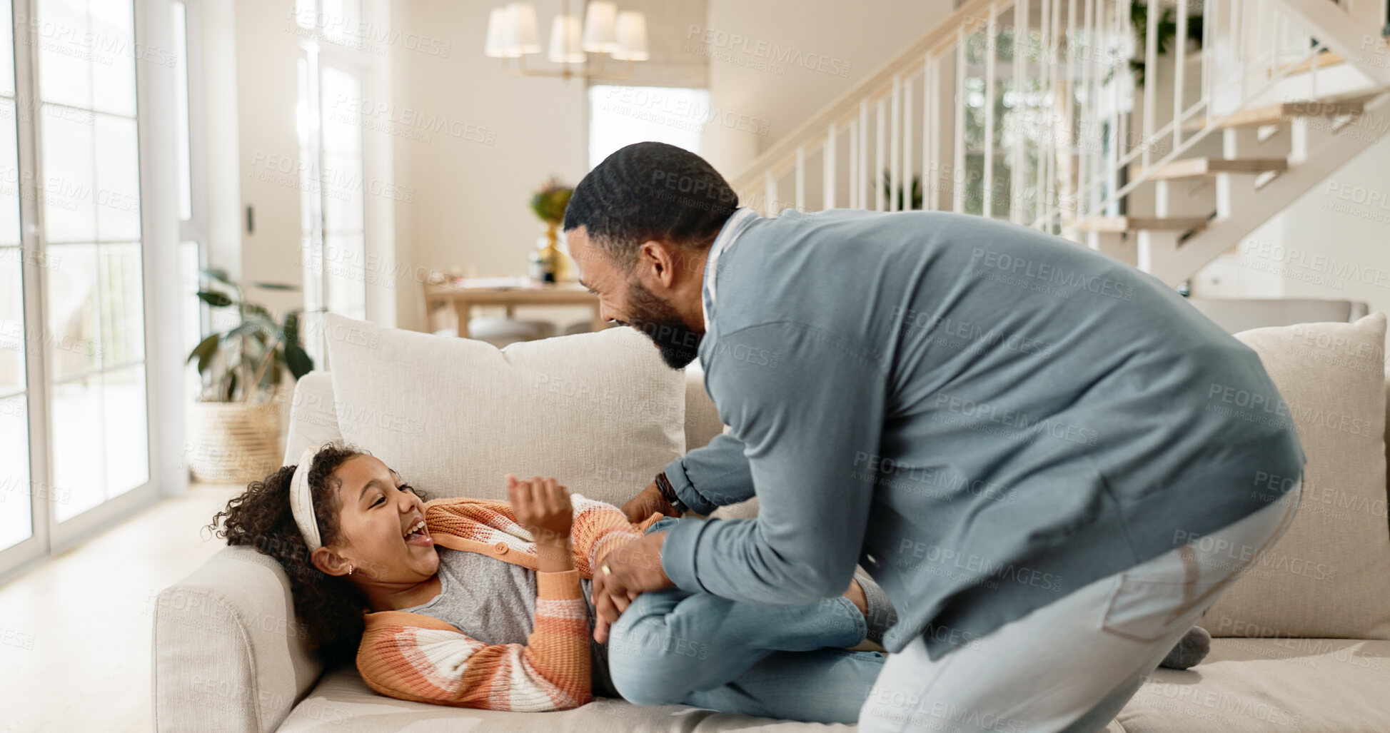 Buy stock photo Father, child and laughing for tickle game on home sofa or parenting bonding, happiness or childhood. Man, daughter and living room connection or love affection in apartment, family house or humor