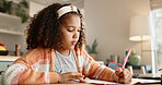 Young girl, student and writing with book in kitchen for homework or assessment at home. Little female person, child or kid taking notes or studying with stationery for learning or education at house