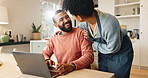 Couple, man and woman with laptop on table for online research and reading blog, with support in home. Love, male and female person together with technology on desk for internet connection or bonding