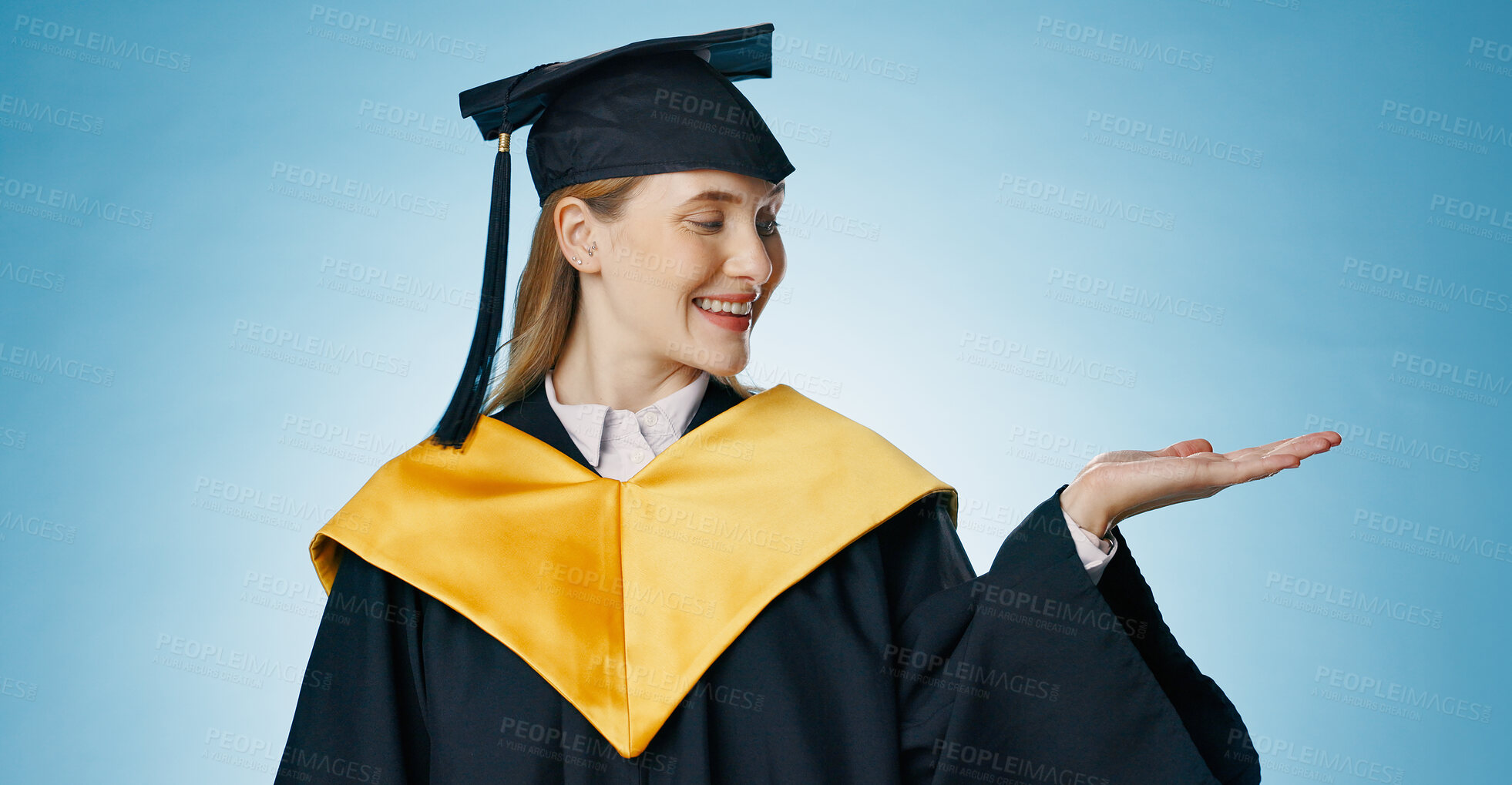 Buy stock photo Palm, graduation and woman on blue background for university, college and academy announcement. Student, school application and happy person with gesture for education, learning and study in studio