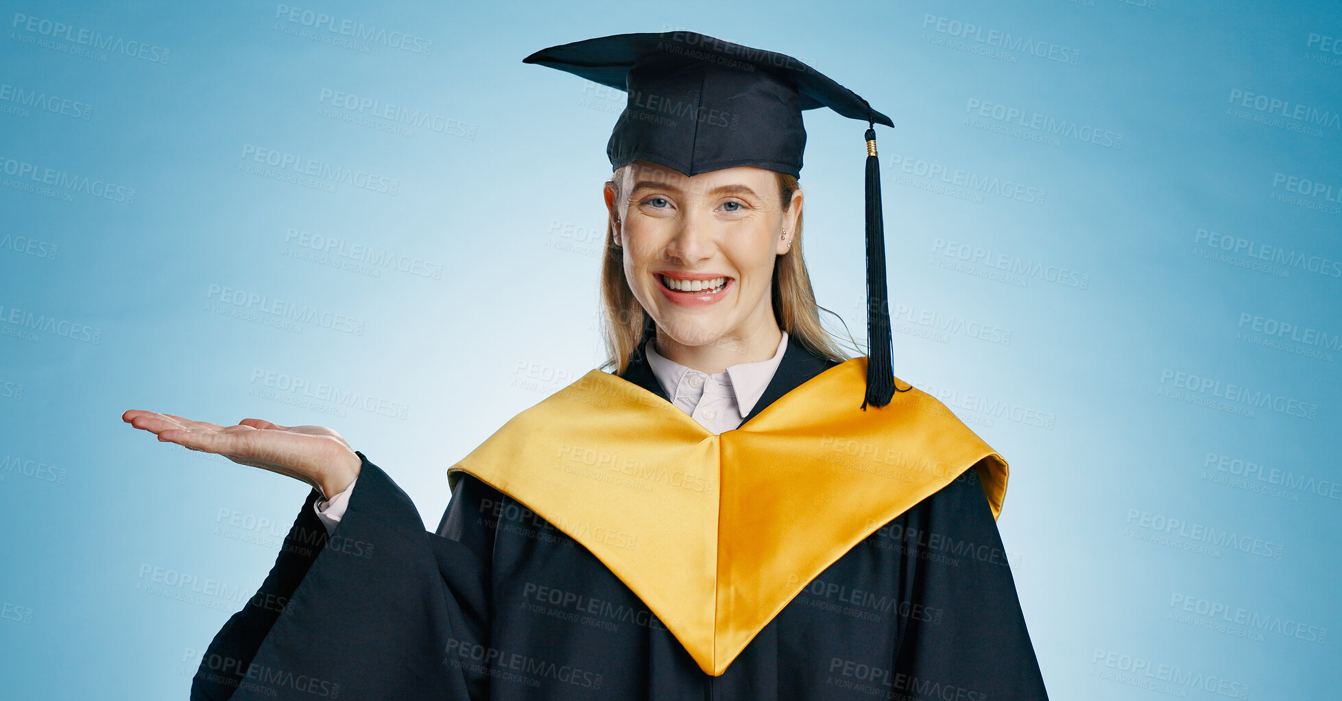 Buy stock photo Hand, graduation and portrait of woman in studio for university, college and academy announcement. Student, school news and happy person for education, learning and studying on blue background