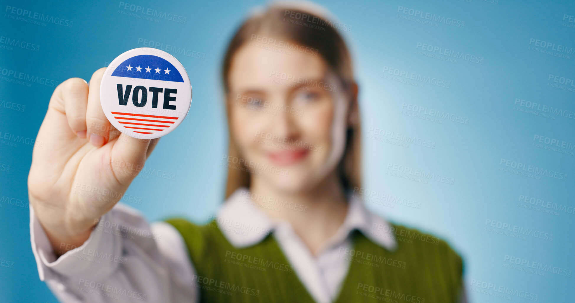 Buy stock photo Vote, badge and hand of woman for elections, political and studio with pin on blue background. Government, support and freedom for choice for female person, register and democracy for USA parliament