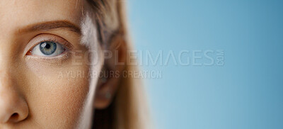 Eyes, woman and portrait with mockup and test for care and wellness with microblading and cosmetics in studio. Dermatology, skincare and eyebrow waxing with makeup and skin glow with blue background