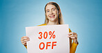 Banner, discount and portrait of woman on blue background for news, announcement and information. Shopping, retail advertising and happy person with sign for price sale, deal and bargain in studio