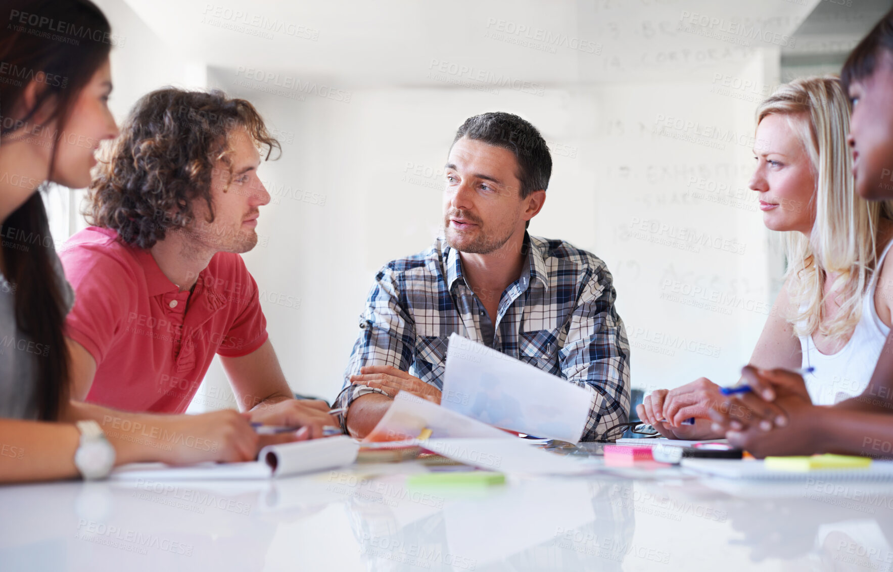 Buy stock photo Group, creative and business people brainstorming at table in meeting, cooperation and collaboration in office startup. Teamwork, designer and color swatches, planning strategy together or discussion