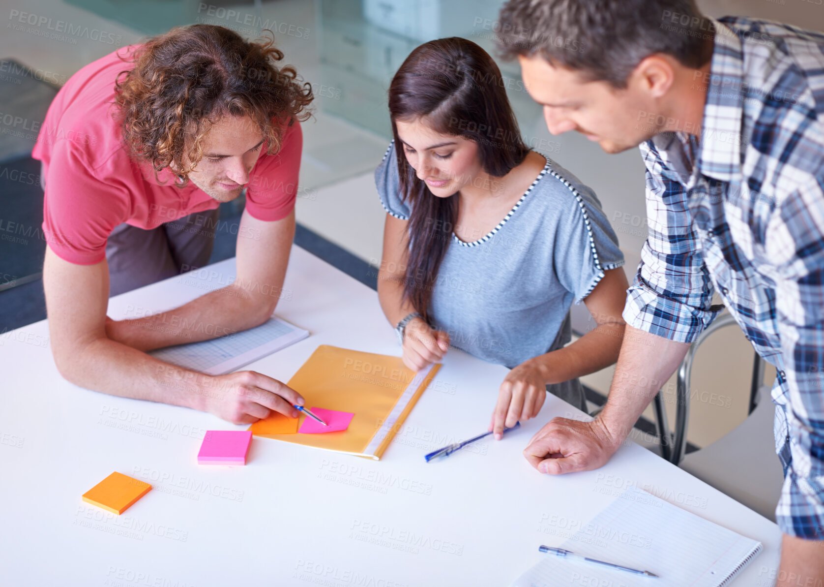 Buy stock photo Three colleagues deciding on the right colour scheme for a photo shoot