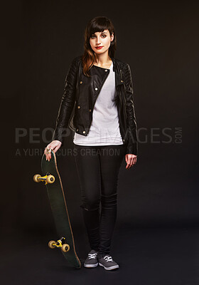 Buy stock photo Fashion, portrait and woman with skateboard in studio for confidence, edgy clothes and satisfaction. Skater, pride and person with tattoos for rebel, grunge style and gen z on black background