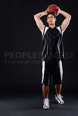 Buy stock photo Basketball, exercise and man shooting in studio for training, workout or healthy body fitness isolated on black background. Sports, player and athlete throw ball for competition, game or mockup space