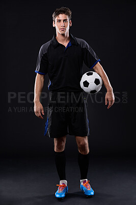 Buy stock photo Sports, soccer ball and man in portrait for fitness, training or practice as athlete or player in football. Male person, passion and game for exercise, wellness and goal on black background in studio