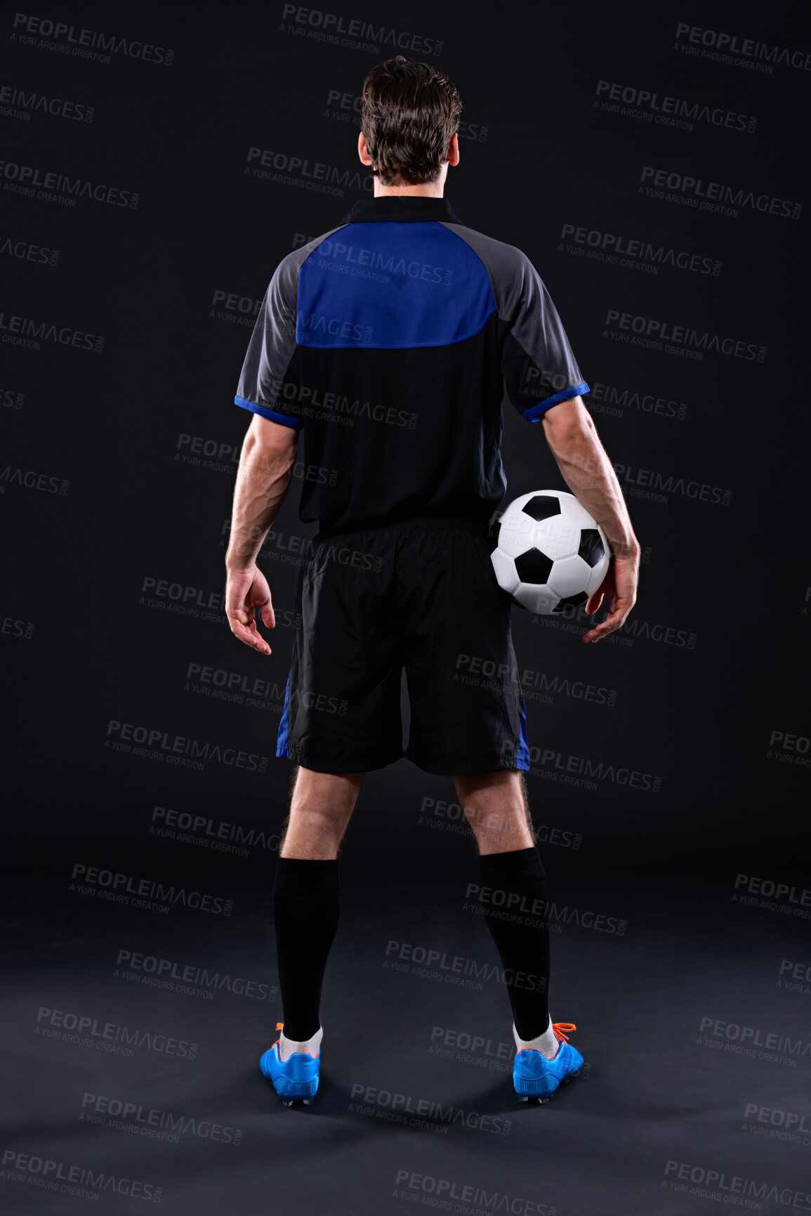 Buy stock photo Back, soccer ball and man in portrait for fitness, training or practice as athlete or player in football. Male person, passion and game for exercise, wellness and goal on black background in studio