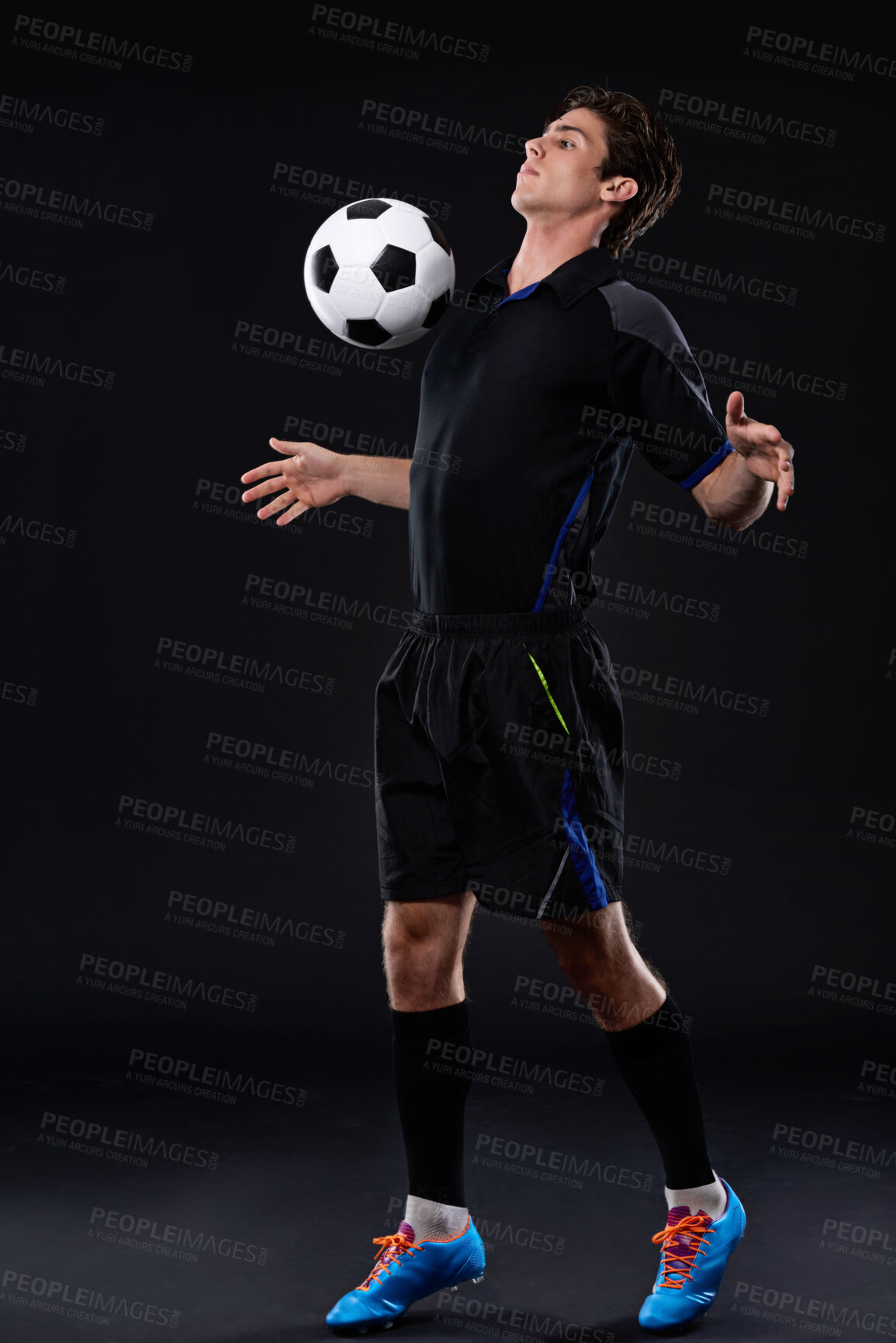 Buy stock photo Football, man and skill for fitness in studio for sports training with exercise isolated on black background. Talent, technique and male athlete with control in soccer kit with healthy professional.