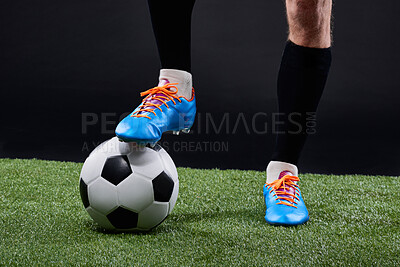 Buy stock photo Field, soccer player and foot with ball for game, training and action for practice with shoes. Black background, athlete and person with talent for football, outdoor and fitness for sport and goal