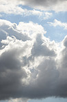 Nature, sunshine and clouds in blue sky with storm, texture and warm climate with meteorology on horizon. Heaven, spiritual air and summer weather with environment, morning and natural skyline