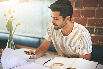 Buy stock photo Man, paperwork and coffee shop with documents in planning, reading or finance at indoor restaurant. Male person or freelancer checking financial budget, journal or planner in notebook on desk at cafe