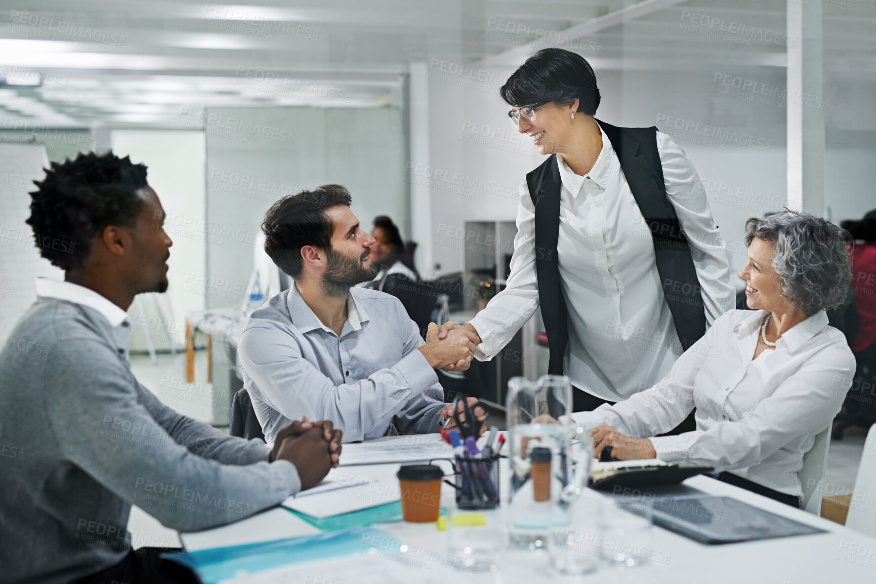 Buy stock photo Business people, handshake and team with meeting for greeting, introduction or agreement at office. Happy group of employees shaking hands for b2b partnership, deal or creative startup at workplace