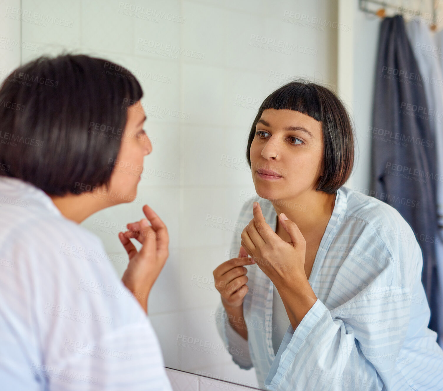 Buy stock photo Skincare, woman and mirror reflection in bathroom for grooming, morning routine and acne breakout. Health, female person and bathrobe with collagen for natural glow or shine for dermatology at home