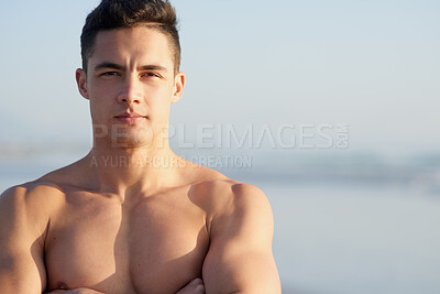 Buy stock photo Fitness, crossed arms and portrait of man on beach for workout, exercise and training outdoors for surfing. Nature, mockup and confident person by sea and ocean for wellness, health and water sports