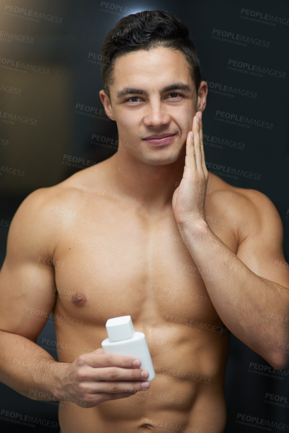 Buy stock photo Man, aftershave and bottle with portrait in bathroom for hygiene, cleaning and morning at house. Person, container and topless with product, grooming or wellness with application, change and liquid