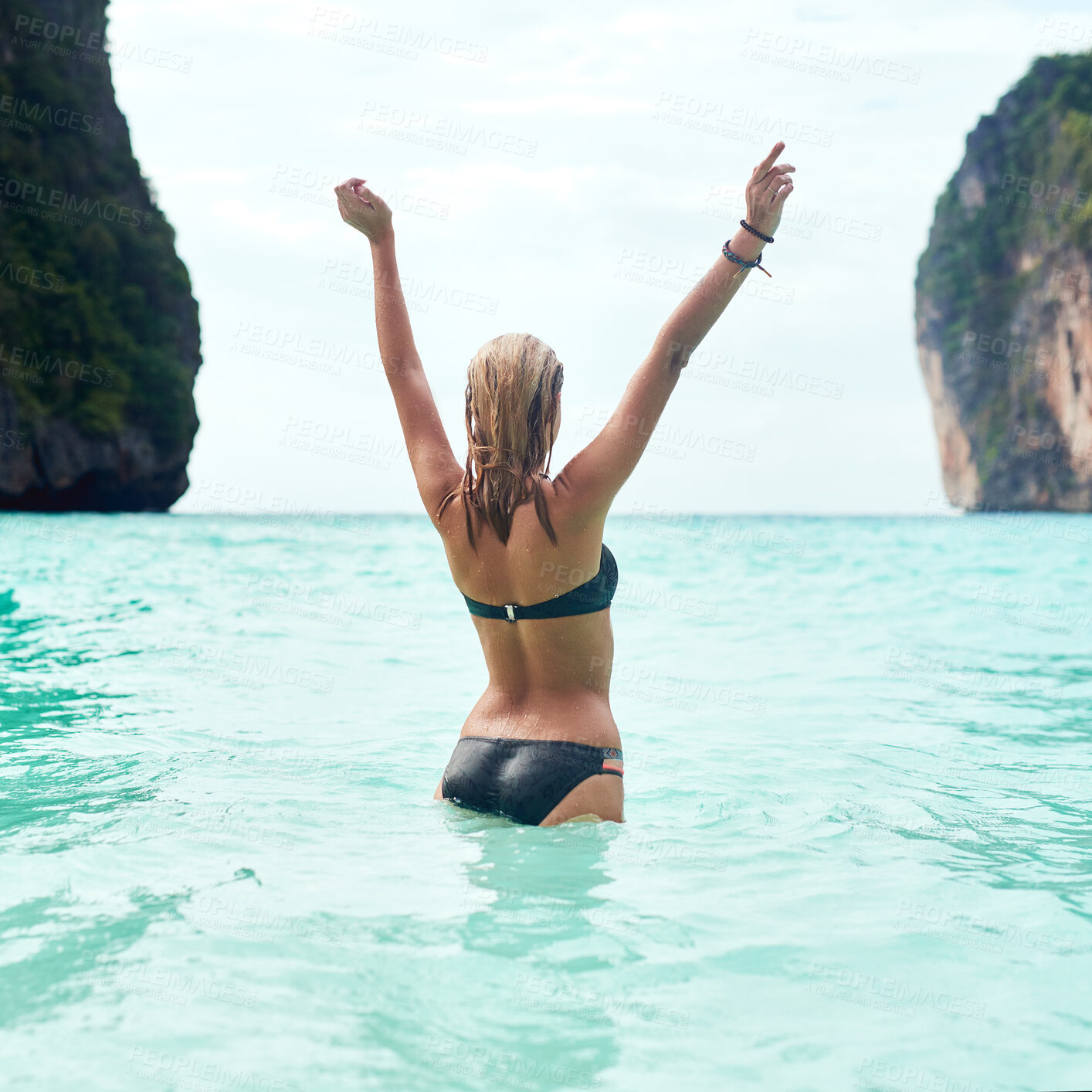 Buy stock photo Woman, ocean and bikini on vacation for freedom in sunshine, travel to Thailand for wellness. Female person, back and arms for beach holiday in summer, relax in water or swimming in natural paradise