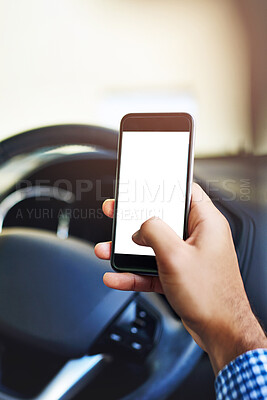 Buy stock photo Cropped shot of an unidentifiable man using a cellphone while driving a car