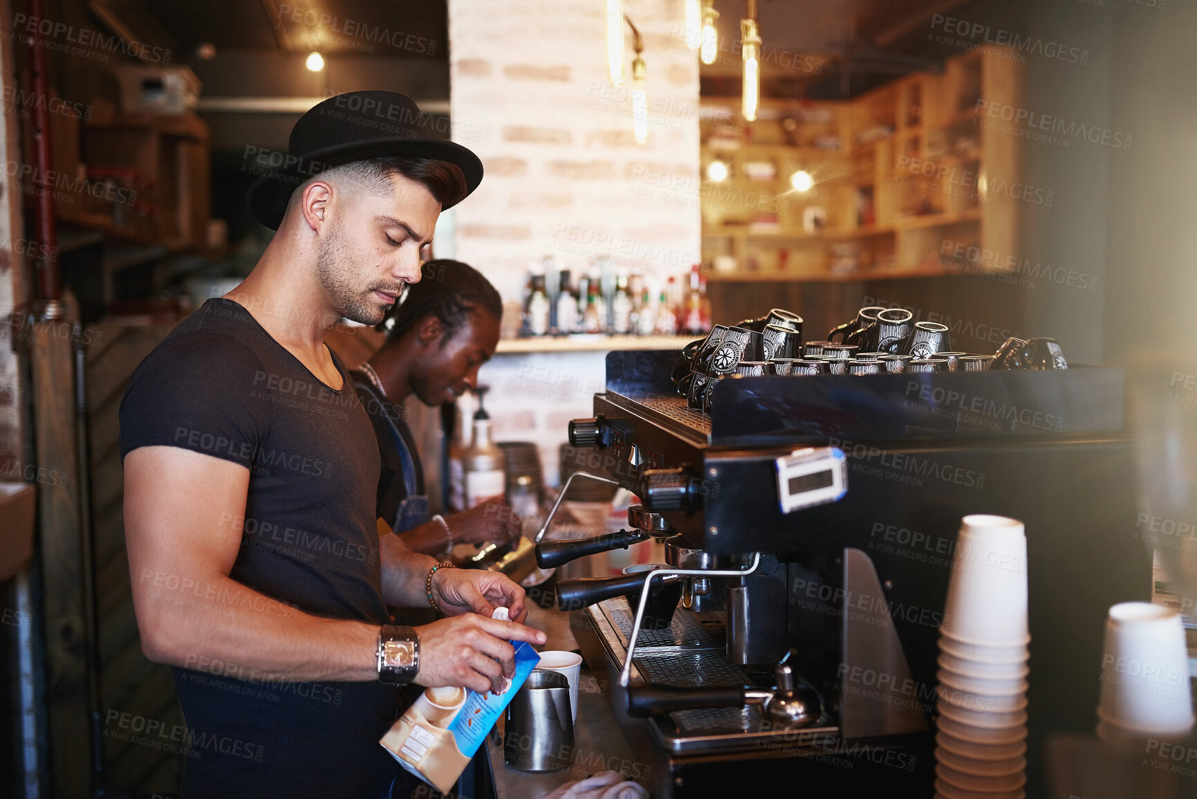 Buy stock photo Barista, coffee shop and man in cafe with machine for serving caffeine, warm drinks and beverage. Restaurant, hospitality and waiter by counter for service, help and working for small business