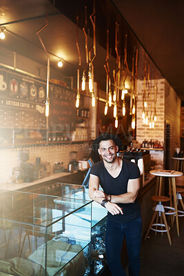 Buy stock photo Happy, coffee shop and portrait of man by counter ready for serving caffeine, drinks and beverage for small business. Restaurant, hospitality and confident waiter for service, help or welcome in cafe