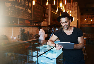 Buy stock photo Tablet, man and coffee shop with creative job and digital freelancer planning a social media post or blog. Smile, restaurant and tech with happy writer with remote work at cafe with internet