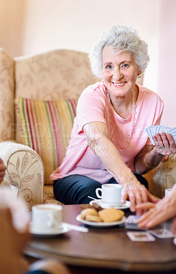 Buy stock photo Portrait, senior woman and poker with friends playing cards in retirement home together. Assisted living, competition or game with happy elderly people in apartment for bonding, fun or leisure