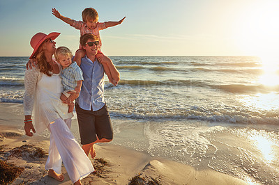 Buy stock photo Happy family, beach vacation and walking, smile for holiday on tropical island. Man, woman and children together with sunglasses by ocean for travel with wellness, mockup space at sunset in Mauritius