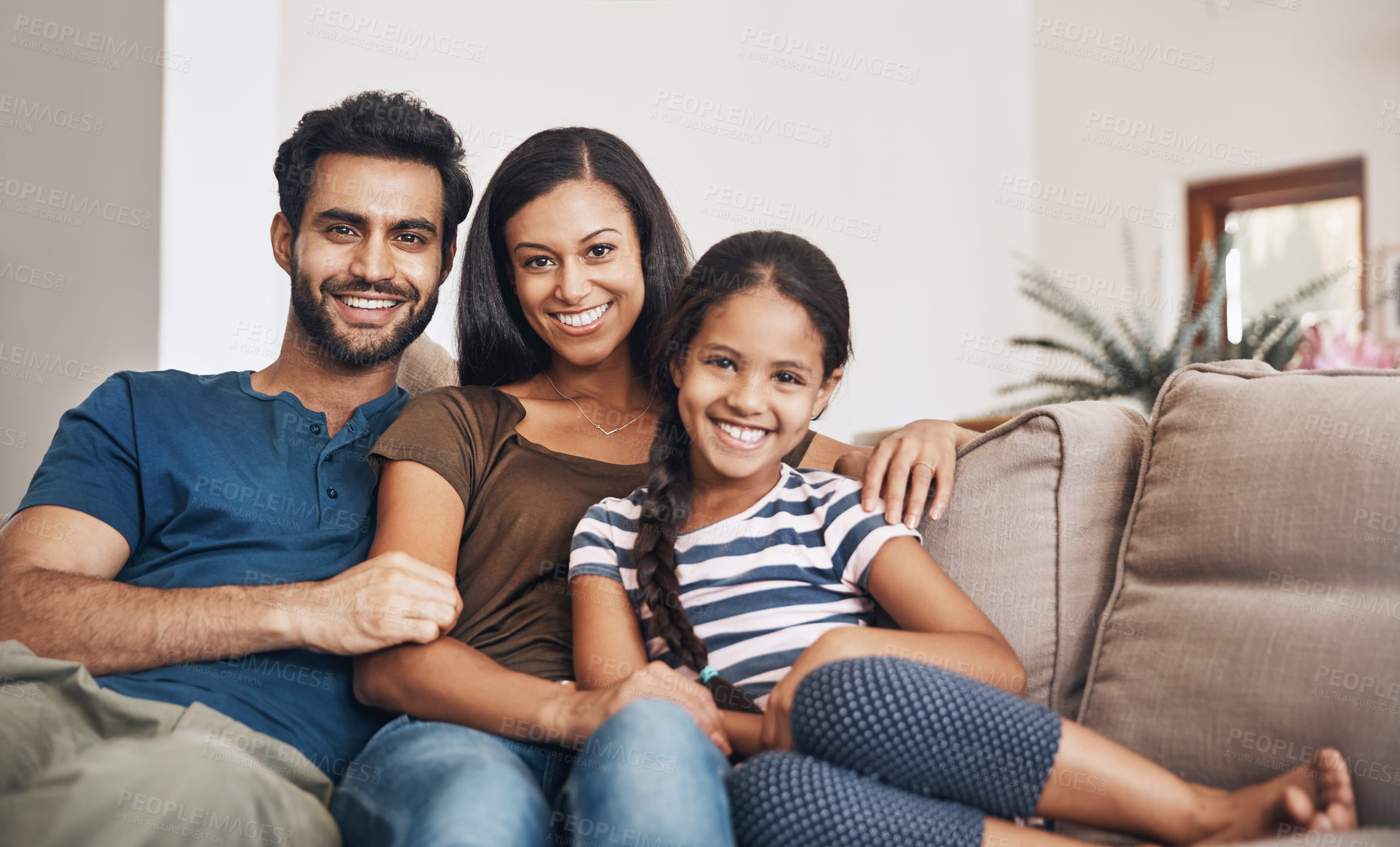 Buy stock photo Happy family, smile and portrait on the sofa to relax, bond and sitting comfortable. Content, quality time and a mother, father and girl child on the living room couch for happiness, love and care