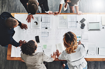 Buy stock photo High angle shot of a group of businesspeople having a meeting in an office