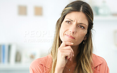 Buy stock photo Cropped shot of an attractive woman looking thoughtful