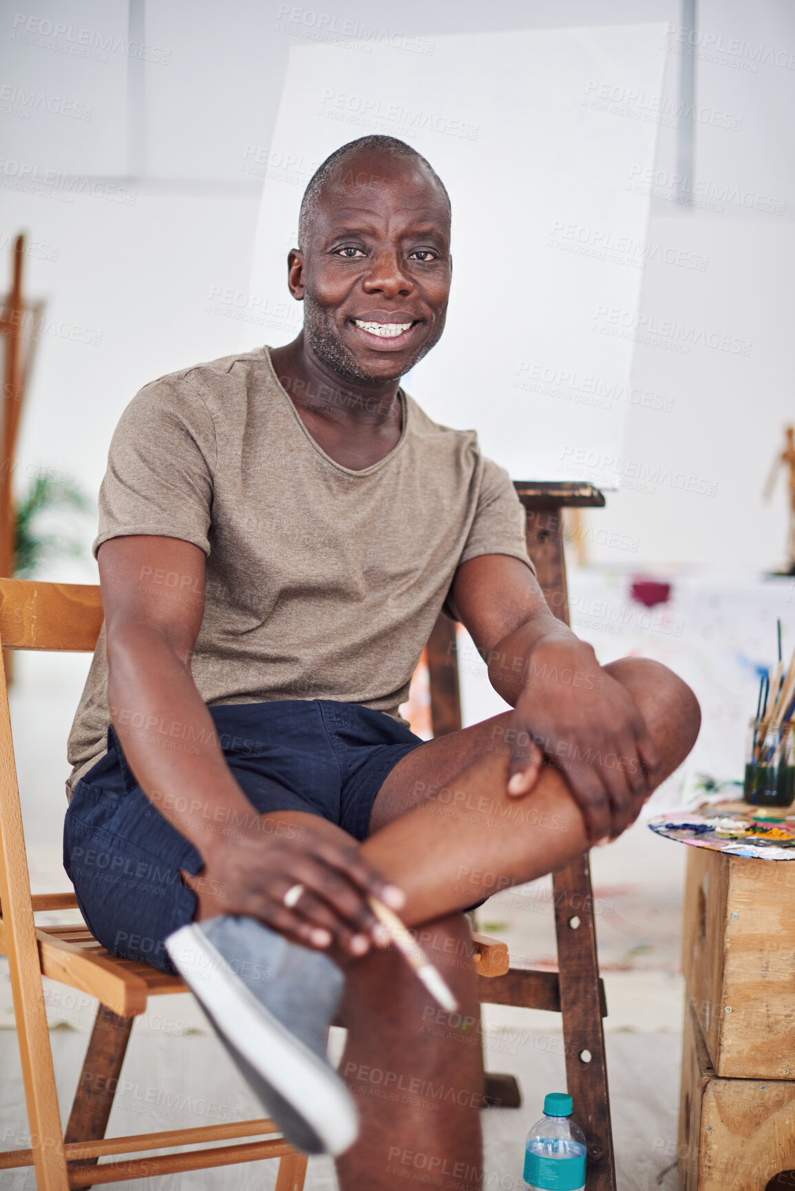 Buy stock photo Portrait, happy and African man in art studio for painting, creativity and idea for student workshop. Professor, mature artist and teacher in education, university and project with paintbrush