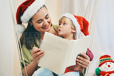 Buy stock photo Mom, boy and reading book at Christmas in home with listening, fantasy and care with Santa hat for celebration. Mother, child and happy with storytelling, bonding and hammock at xmas in family house