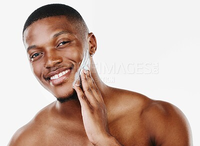 Buy stock photo Grooming, black man and portrait with face cream, routine and wellness in care, hygiene on white background. Male person, cosmetic and fresh in skincare, masculine or confident with product in studio