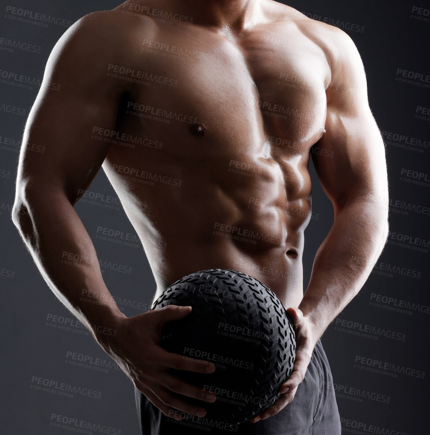 Buy stock photo Ball, hands or strong man in studio for bodybuilding workout, training or exercise for power or strength. Black background, fitness or topless athlete with equipment for sports challenge or wellness