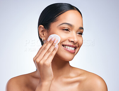 Buy stock photo Beauty, woman and happy with cotton pad in studio for skincare, dermatology and glow or shine. Cosmetics, model girl and smile by white background for makeup removal, spa treatment and cleaning 