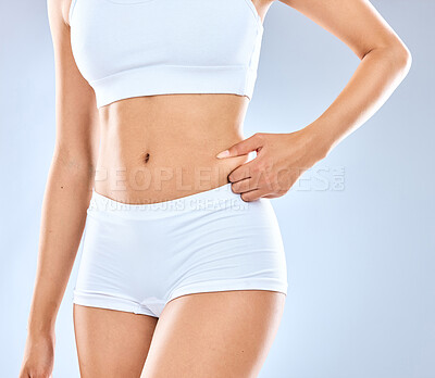 Buy stock photo Woman, health and fitness with stomach for diet with training for results in studio background. Hands, abdomen and workout for slimming with wellness for nutritious body transformation in Spain.