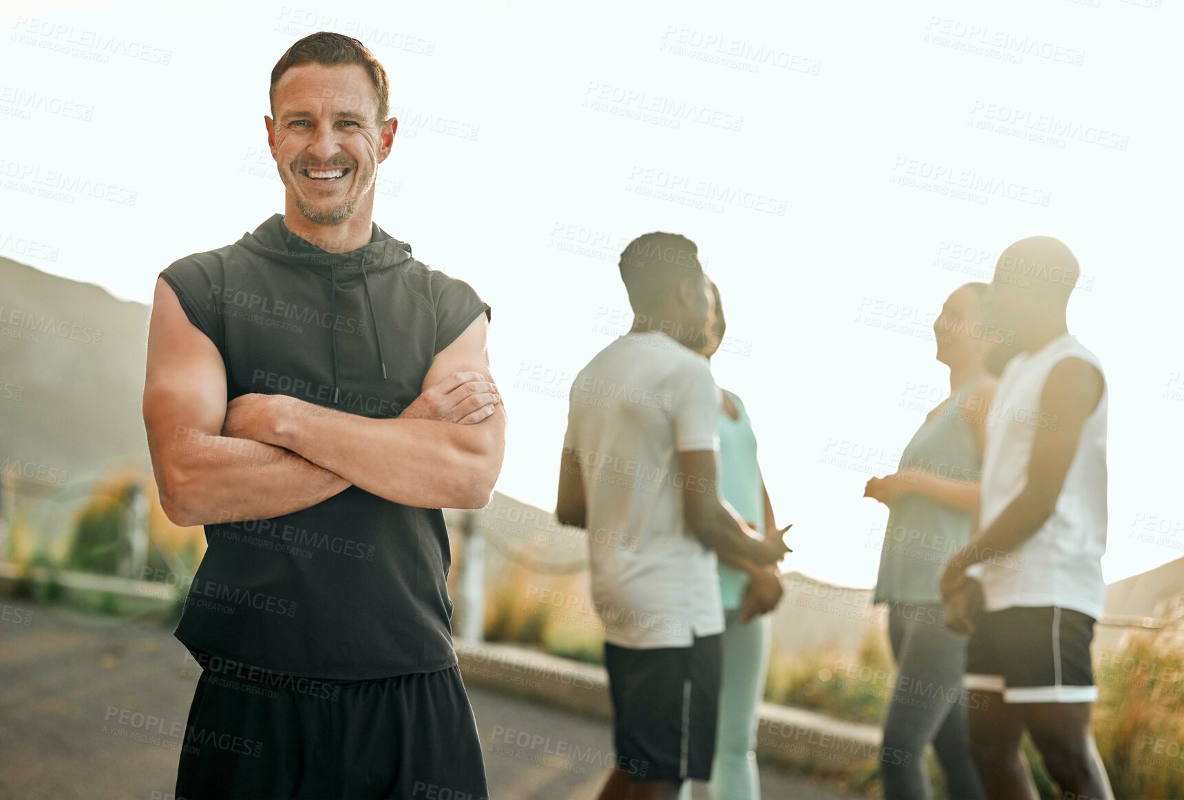 Buy stock photo Runner, portrait and man with arms crossed in road for fitness, endurance training or marathon exhibition. Mountain, diversity and athlete with friends for cardio, race or performance challenge