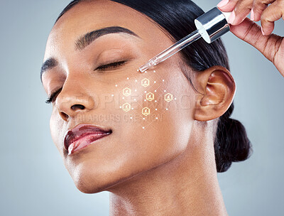 Buy stock photo Indian woman, skincare and serum with dropper for beauty, product and hydration on studio background. Dermatology overlay, cosmetics and wellness for hyaluronic acid, vitamin a or collagen facial