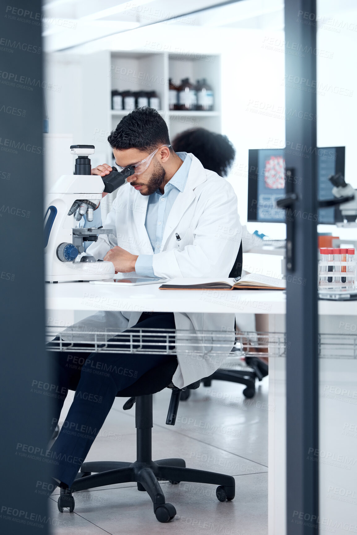 Buy stock photo Microscope, man and analysis in laboratory for science, research and ppe for investigation. Technology, review and dna or data for healthcare with scientist and development for pharmaceutical company