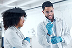 Two young science experts conducting a research experiment in the lab together. Two scientists collaborating, brainstorming during a meeting. Medical colleagues planning and writing ideas on a board