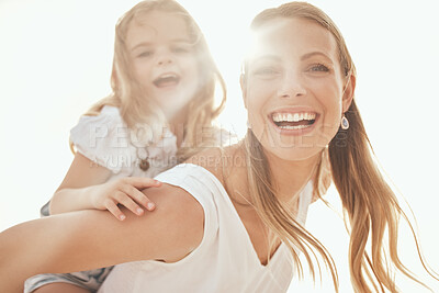 Buy stock photo Mother, girl and piggyback portrait in outdoor, laughing and comedy in carrying game by sky. Mommy, daughter and freedom for bonding on vacation, happiness and play together for adventure on holiday