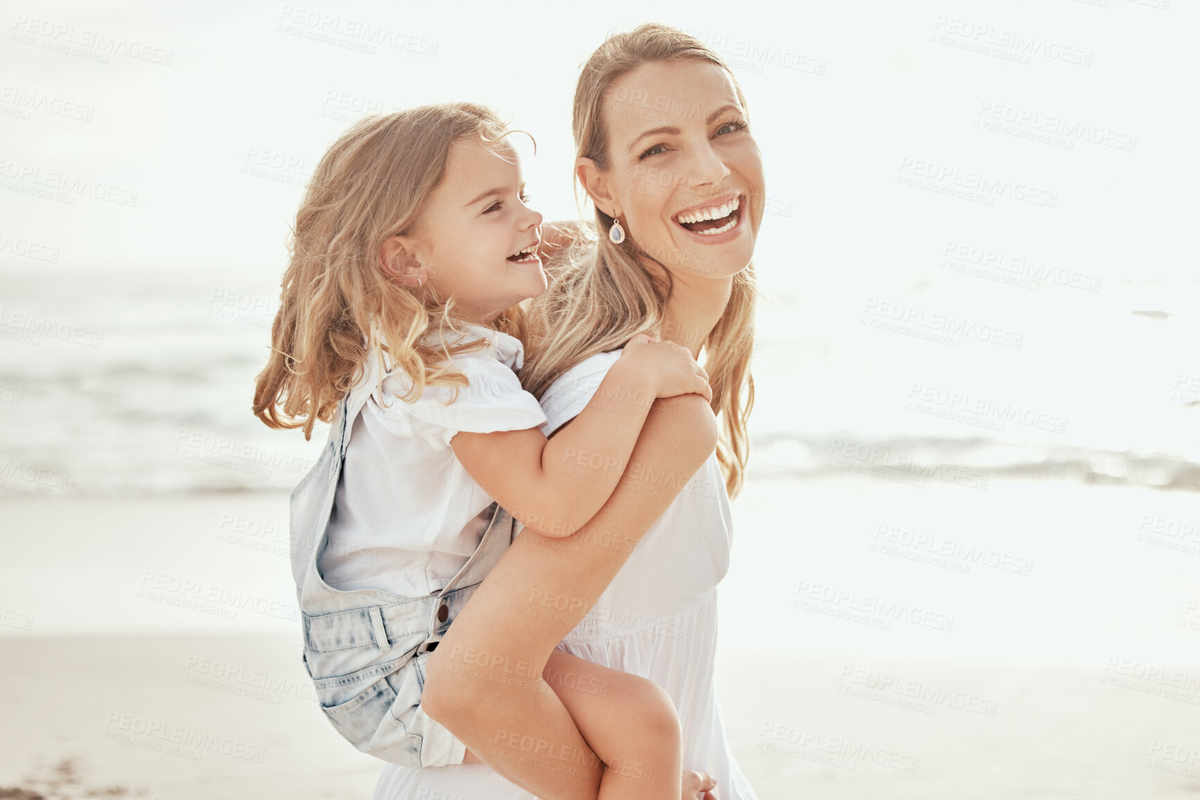 Buy stock photo Happy, portrait or mother and daughter at beach for piggyback love, trust and support, laugh and bonding in nature. Travel, family and mom with kid at the ocean for back ride fun, adventure or games