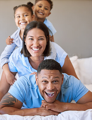 Buy stock photo Family, morning and portrait on bed for love, smile and connection or security in home for bonding. Parents, children and relax in bedroom for peace, wake up and embrace for support or pile on dad