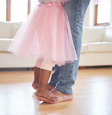 Buy stock photo Father, child and dance on feet in home for love with bonding together, trust and family fun in living room. Closeup legs, kid and African dad with princess girl for teaching or learning ballet steps