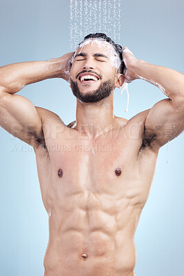 Buy stock photo Shower, shampoo and man with skincare, grooming and fresh morning bathroom routine on blue background. Health, wellness and male person in water with cleaning soap, washing hair and hygiene in studio