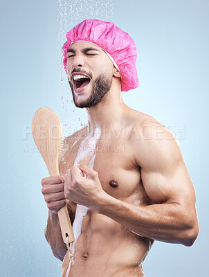 Buy stock photo Shower, singing and man with brush for grooming, skincare and morning routine on blue background. Health, wellness and happy male person in water with cleaning, soap and music with hygiene in studio